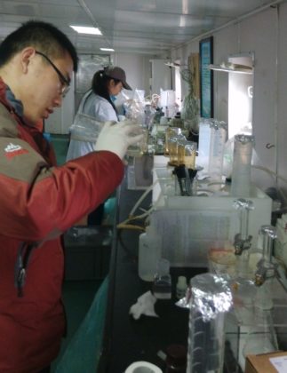 Researchers process water samples onboard, preparing them for formal lab analysis. (Image: Li Daoji)