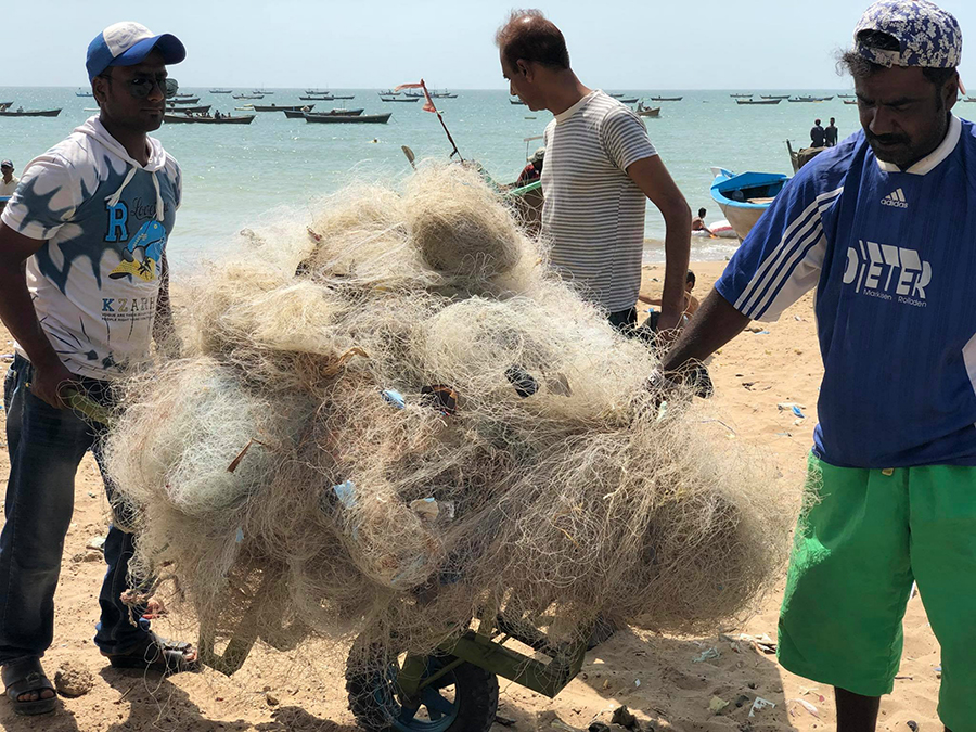 Saquib Mehmood and team sorting out the recovered ghost nets from the sea.