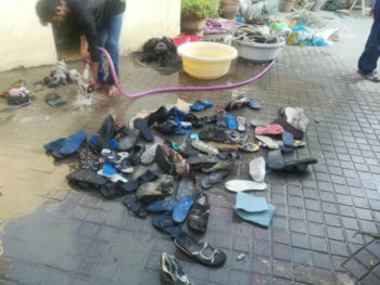 Shoes recovered from Marine Conservancy being washed and cleaned. 