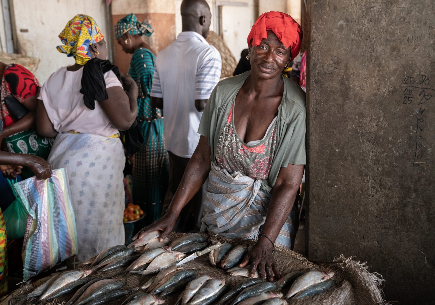 Local woman selling fresh fish, the same type as are sent to the FMFO factories