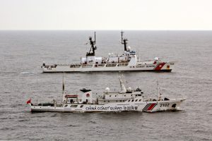 <p>US Coast Guard Cutter Morgenthau steams alongside the Chinese Coast Guard vessel 2102 as they transfer custody of the fishing vessel Yin Yuan detained for illegal fishing. (Source: <a href="https://www.alamy.com/image-details-popup.asp?imageid=b61f0026-bd4f-4e0d-8ea5-c356bb0c1f97&amp;srch=&amp;Stamp=3&amp;imageType=0">Alamy</a>)</p>