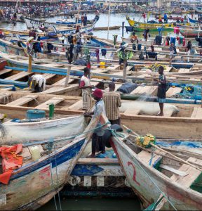 <p>Traditional fishers in Elmina harbour, Ghana (Image: Alamy)</p>