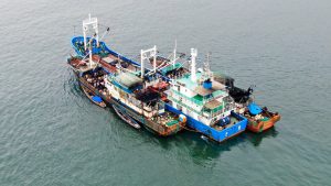 Chinese vessels conduct an illegal transhipment – the transfer of fish from one vessel to another at sea – off the coast of West Africa.