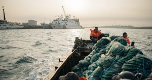 <p>The Shandong authorities are pushing “marine ranching” as an alternative to coastal aquaculture. Skipper Li Zhonghua (centre) and two employees are on their way to their offshore ranch (Image: Liu Yuyang)</p>