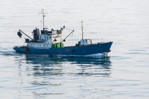 <p>At least 20% of seafood worldwide is caught illegally, representing a loss of US$10 &#8211; US$23 billion (Image by <a href="http://www.thinkstockphotos.com/image/stock-photo-silhouette-of-engaged-fishing-craft/875342920">MenzhiliyAnantoly/ Thinkstock</a>)</p>