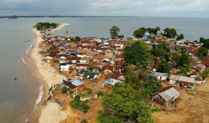 <p>Villagers on Plantain Island are being forced to move away as the sea erodes their coastline and washes away their homes (Image: Saidu Bah / China Dialogue Ocean)</p>
